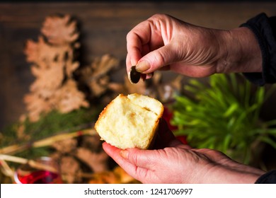 Person Finding Coin In Orthodox Christmas Eve Bread