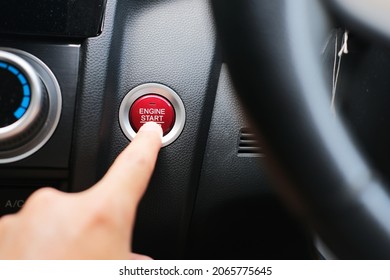 Person Finger Pressing Car Engine Start Button