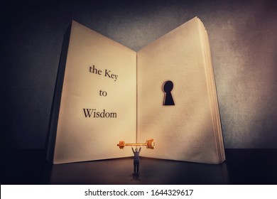 Person Found The Magic Golden Key To Wisdom, Stands Near The Giant Book With A Keyhole Inside Pages. Open The Lock To Knowledge, Ambition And Motivation Concept. Unlock Your Mind, Intelligence Symbol.