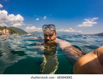 Person Free Diving And Holding Action Cam To Take A Selfie  