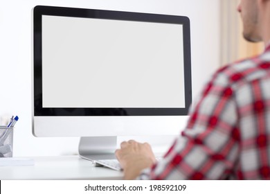 Person front of empty computer monitor, back view