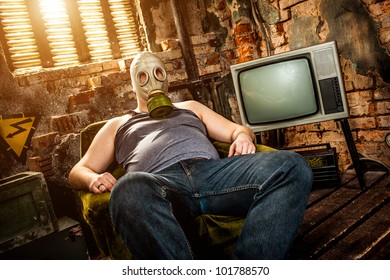person in a gas mask sits on an armchair - Powered by Shutterstock