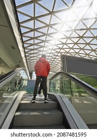 Person Going Up An Escalator. Climbing To The Top