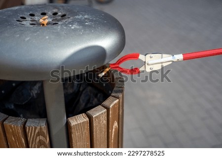 Similar – Image, Stock Photo Person with Grabber Reacher Tool