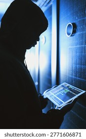 Person, hacker and tablet screen in server room at night for coding, cyberattack and data breach. Suspicious, criminal and digital with code script for hacking system, firewall bypass and espionage