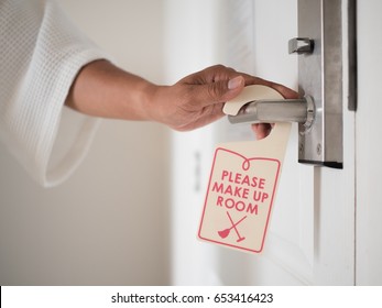 A Person Hand With Do Not Disturb Sign For Private Time Moment Of Hotel And Resort Bedroom Background