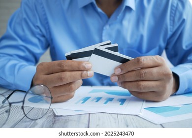  person hand holding many credit cards  - Shutterstock ID 2025243470