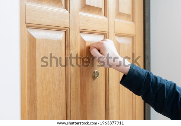 person hand\
knock the door, visit the friends\
house