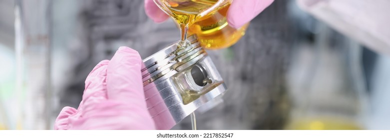 Person Hand In Rubber Pink Gloves Holding Car Part And Pours Lubricating Oil On Top