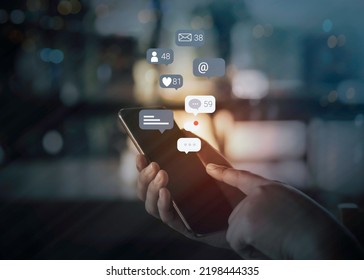 Person hand using a mobile phone with social media marketing concept. - Powered by Shutterstock