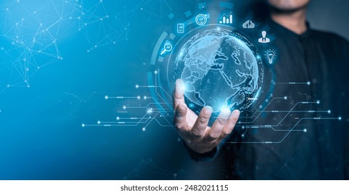 A person holding a digital globe with business and technology icons, representing global connectivity and innovation.