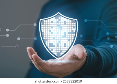 Person holding a digital shield symbolizing data security and protection in technology, illustrated with binary patterns. - Powered by Shutterstock - Get 15% off with code: PIKWIZARD15
