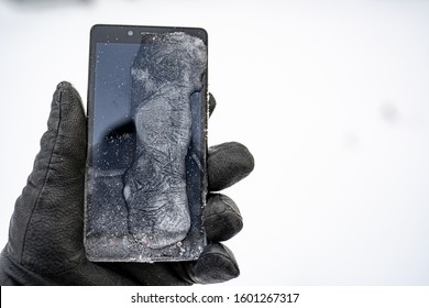 Person Holding Frozen Smart Phone