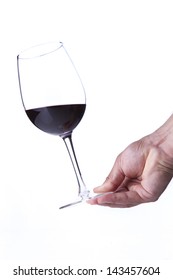 Person Holding A Half Full Glass Of Red Wine