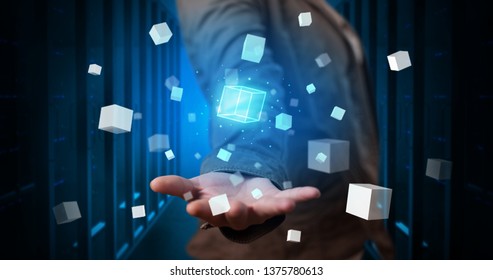 Person holding hologram projection displaying white cubes in server room - Shutterstock ID 1375780613