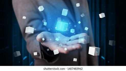 Person holding hologram projection displaying white cubes in server room - Shutterstock ID 1407483962