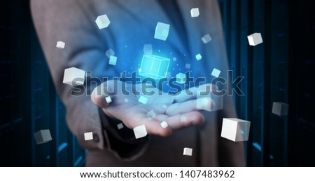 Person holding hologram projection displaying white cubes in server room