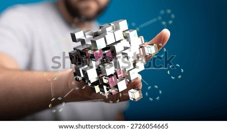 Person Holding Interconnected Data Cubes