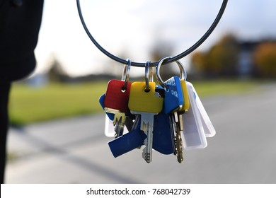 a person holding keys in her hand