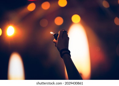 Person Holding Lighter On A Concert.