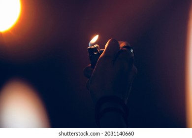 Person Holding Lighter On A Concert.