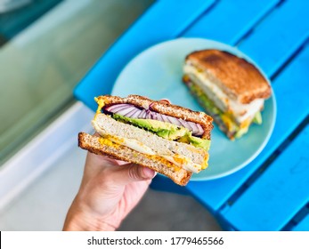 Person Holding Sandwich Half In Hand Healthy Eating