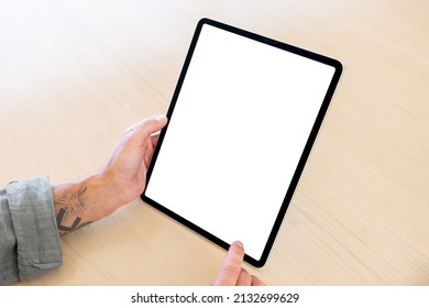 Person Holding Tablet Computer Vertically In Hands, Blank White Screen Mockup