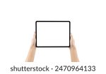 A person is holding a tablet with a white screen. The tablet is empty and the person is holding it in their hand