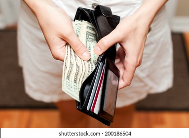 Person Holding Wallet With Money