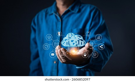 A person holds a glowing cloud computing system with digital icons representing cloud storage, security, networking, and data analytics. The futuristic tech interface symbolizes information systems.