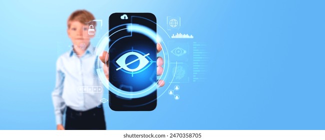 A person holds a smartphone displaying a digital eye symbol, with transparent security icons overlaying the image. Light blue background. Concept of digital security and privacy - Powered by Shutterstock