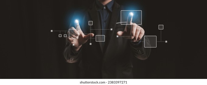 Person with hologram flowchart, businessman designing flowchart business workflow to systematically qualitatively, flowcharting to visualize the workflow of the program. Flowchart design concept.