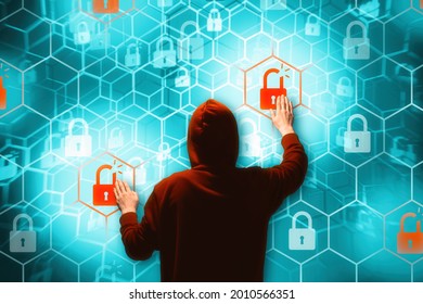 Person in a hoodie is hacking computer networks security. - Powered by Shutterstock