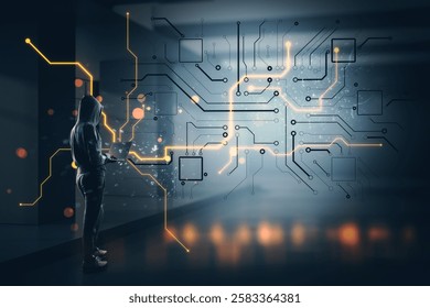 A person in a hoodie holding a laptop stands near a glowing digital circuit board with a dark blurred background. Cybersecurity concept - Powered by Shutterstock - Get 15% off with code: PIKWIZARD15