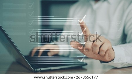 Person interacting with digital checklist or dropdown list on laptop screen, representing selection, decision-making, and online forms.