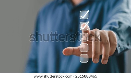 A person interacting with a digital checklist, emphasizing task completion and productivity in a modern workspace.
