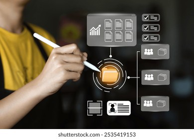 A person interacting with a digital interface represents the management of user data or identity. User profile icon