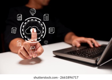 A person interacting with a digital interface, showcasing cloud computing features on a laptop, emphasizing technology and data management.