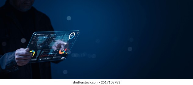 Person interacts with an advanced transparent tablet, displaying dynamic data visuals sleek interface analytics and real-time information against dark, atmospheric backdrop - Powered by Shutterstock