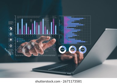 A person interacts with data visualizations on a laptop, displaying graphs and statistics, illustrating technology and analytics.
