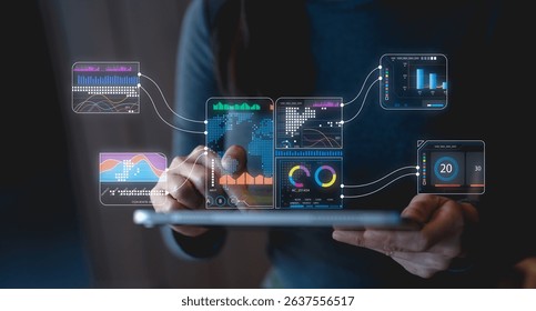 A person interacts with digital data visualizations and analytics using a tablet, highlighting modern data analysis technology.
