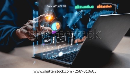A person interacts with digital data visualizations on a laptop, showcasing analytics and statistics in a modern workspace.