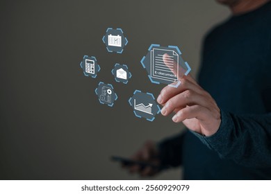 A person interacts with a digital interface displaying icons like e-documents, charts, and calendars, symbolizing technology, data management, and efficient virtual office solutions.