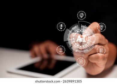 A person interacts with a digital interface displaying futuristic AI-themed icons above a tablet device on a dark background.