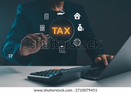 A person interacts with a digital interface displaying tax-related icons, emphasizing financial management and accounting.