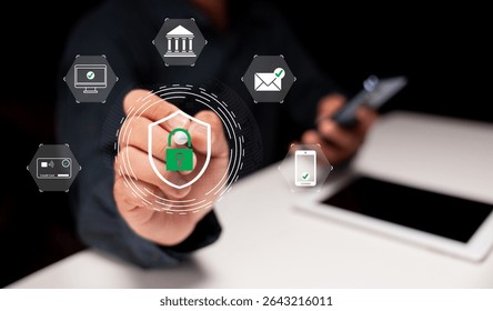 A person interacts with a digital interface showcasing cybersecurity icons like a padlock, bank, email, and mobile security on a dark background.