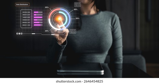 A person interacts with a futuristic digital interface displaying data charts and holographic elements, symbolizing technology and data analysis.