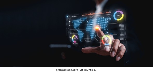 A person interacts with a futuristic digital interface displaying global data and analytics on a transparent screen.