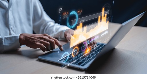 A person interacts with a laptop displaying vibrant data visualizations and graphs, symbolizing data analysis and technology usage in a modern workspace. - Powered by Shutterstock - Get 15% off with code: PIKWIZARD15