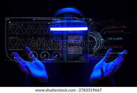 A person interacts with a transparent digital interface showcasing data metrics and waveform analysis, embodying modern technology and virtual reality in a dark setting.